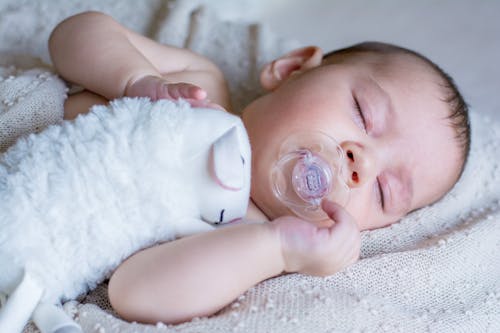 Baby Sleeping with a Pacifier