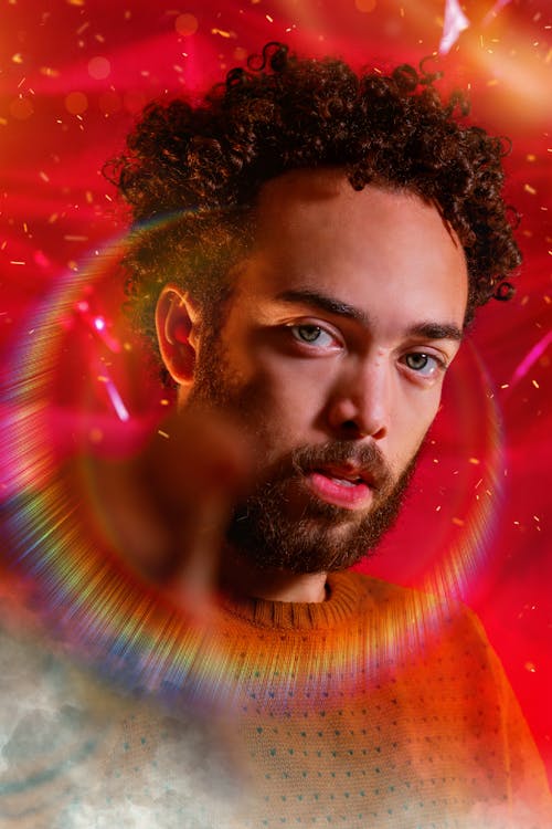 Serious man with rainbow halo around head