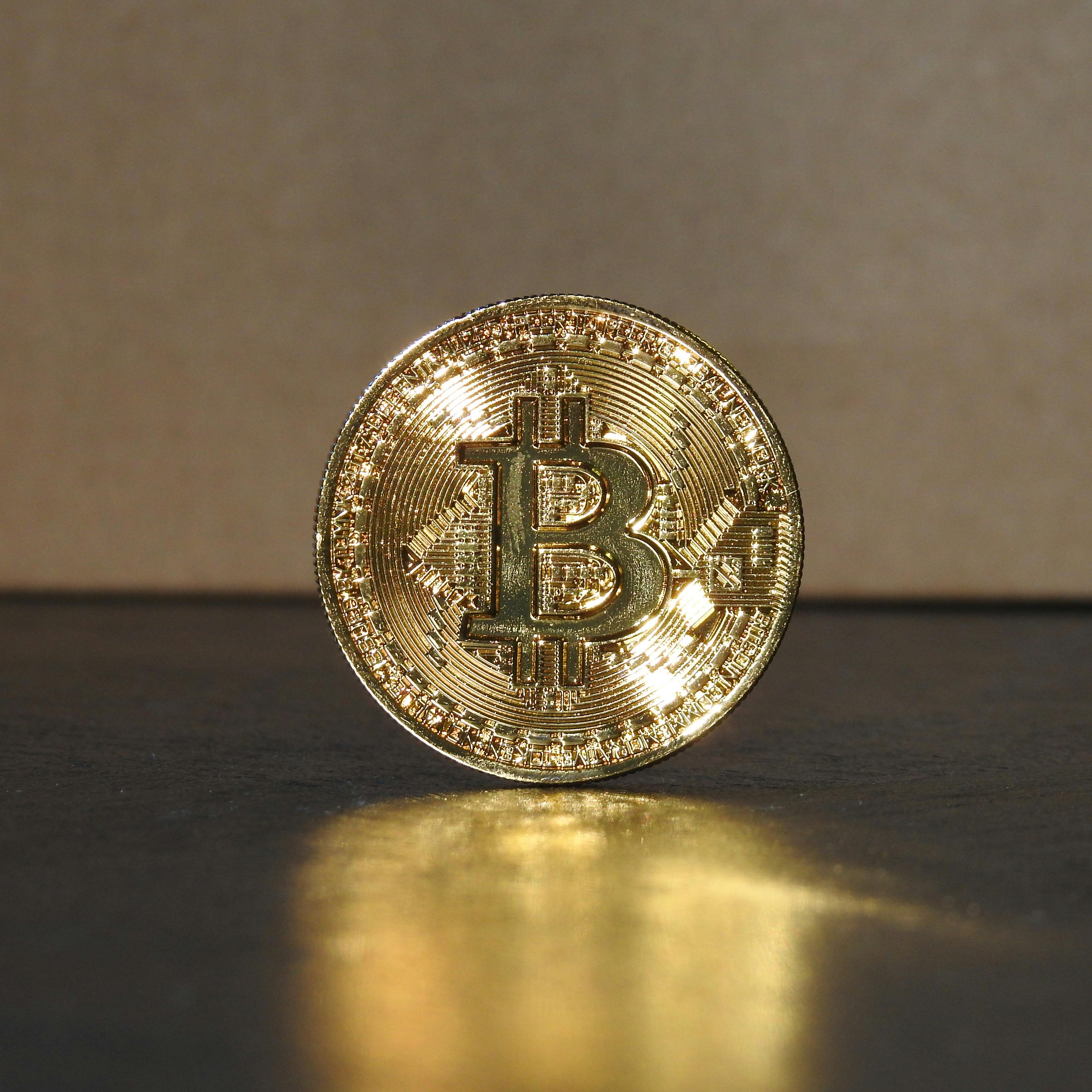 a gold coin on a surface