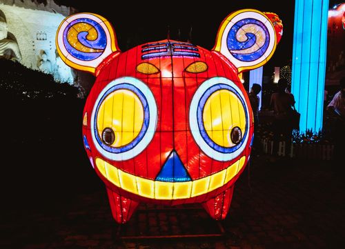 Free Colorful lantern shaped like a cartoon character, illuminated during a night festival event. Stock Photo