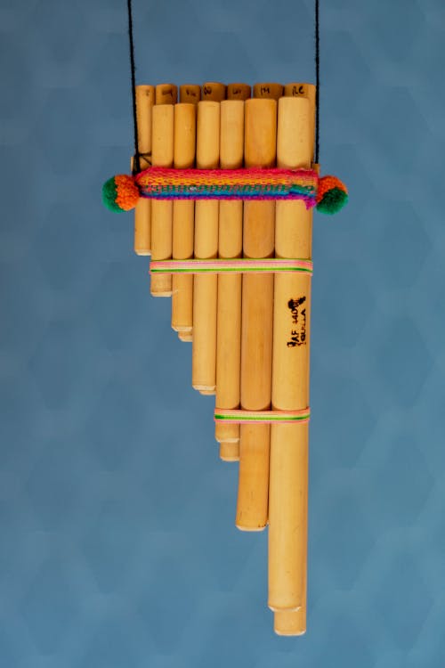 A Pan Flute With Blue Background