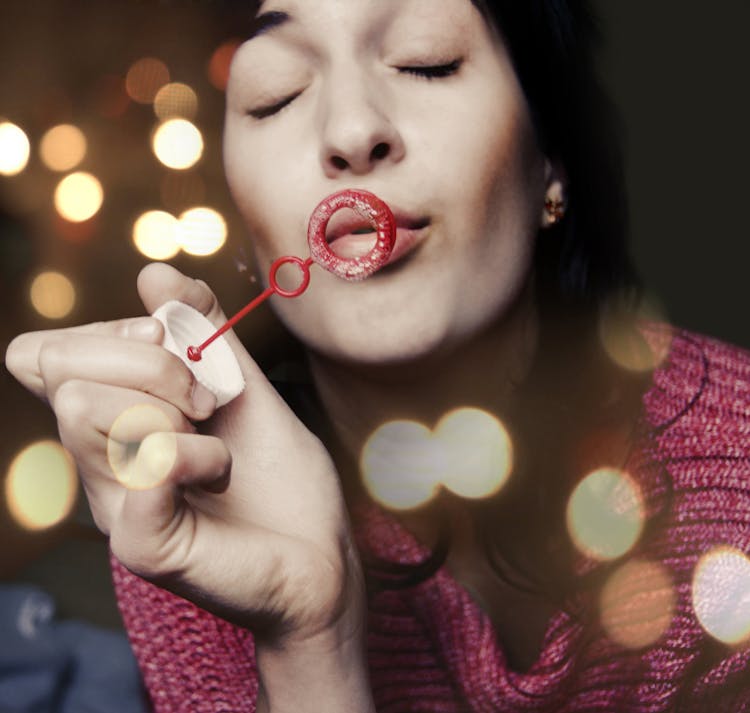 A Woman Blowing Bubbles