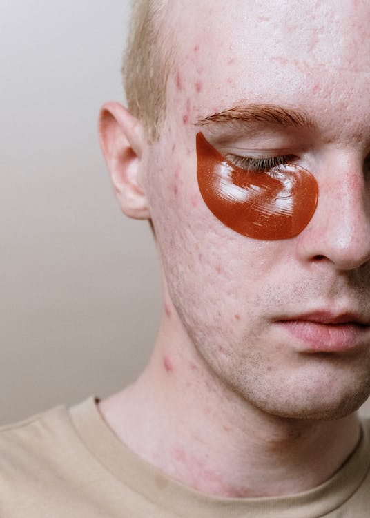 Free Man With Orange Powder on His Face Stock Photo