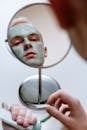 Person Holding Mirror With White Powder