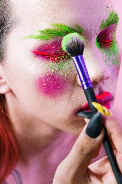 Woman With Pink Lipstick and Black Eyeshadow