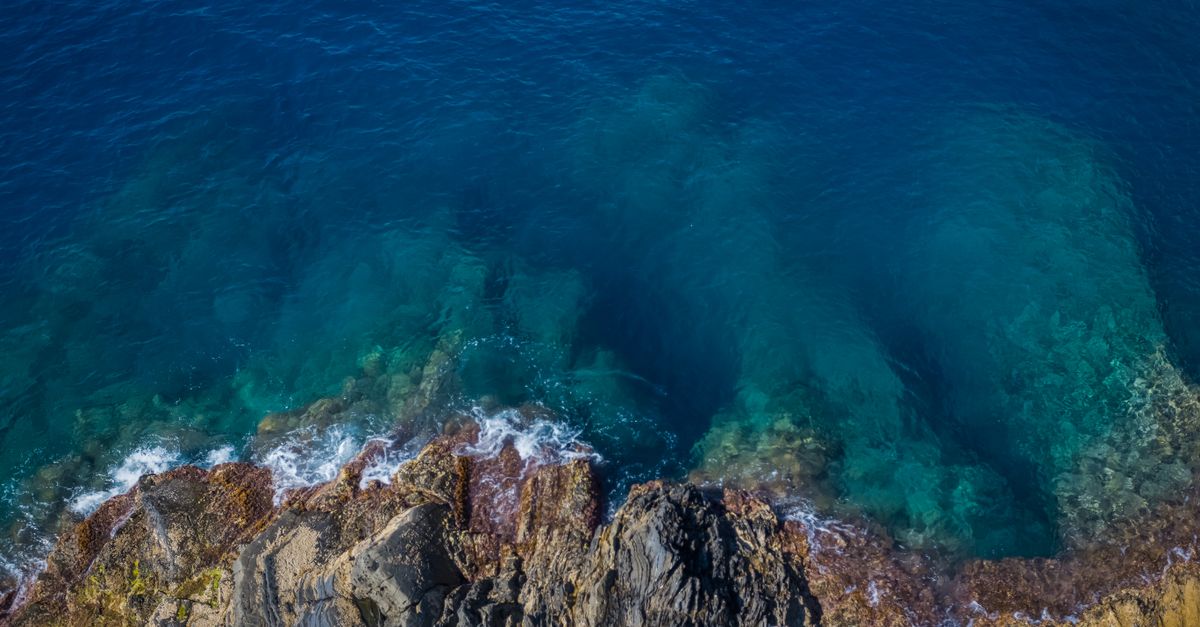 Color Deep Sea Rocks Rock Formation On Deep Blue Sea · Free Stock Photo