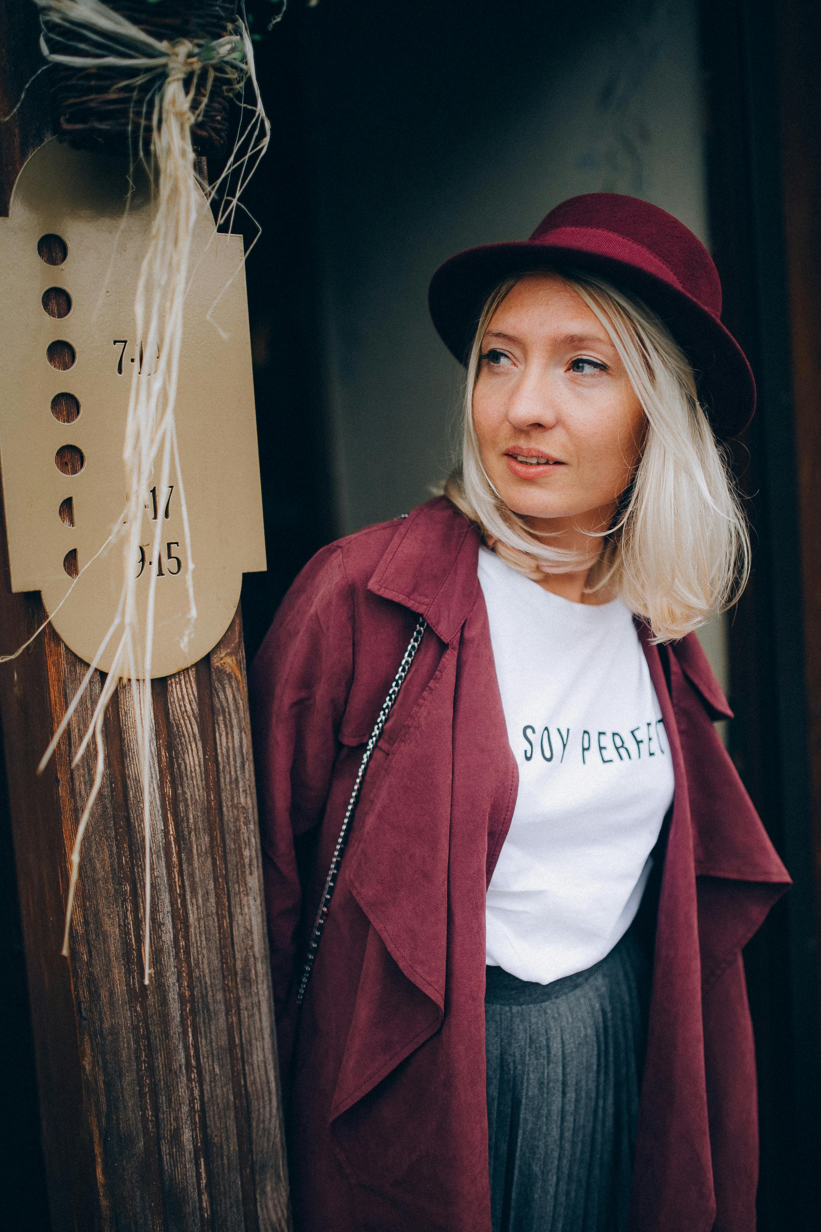 Woman With Blond Hair in Red Coat and White Shirt · Free Stock Photo