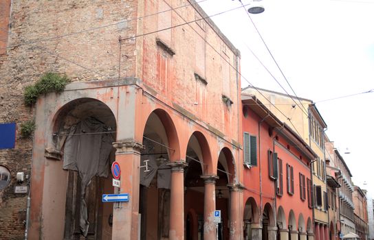 Discover the vibrant and rustic architecture of an old European town with colorful facades.