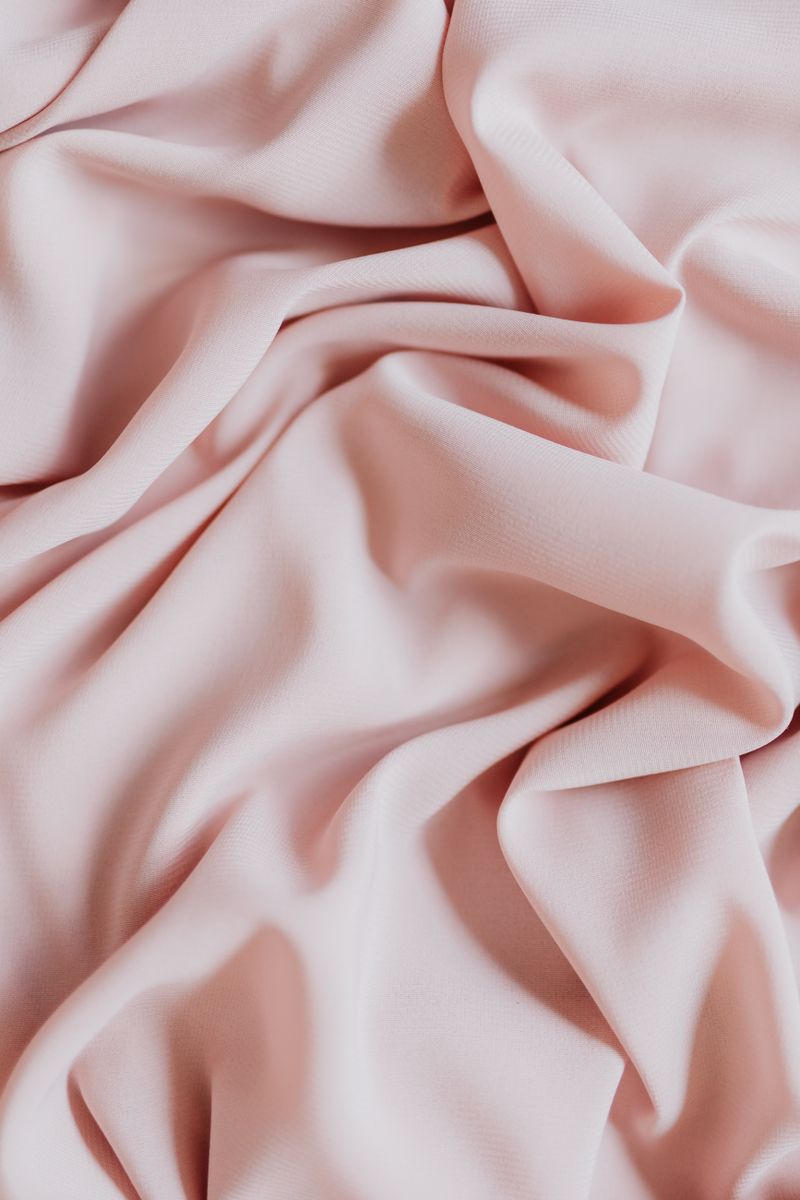 Close-up of the soft blush cotton-jersey fabric and its folds — photo by kaboompics.com on Pexels