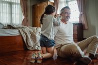 Father and Daughter Playing at Home