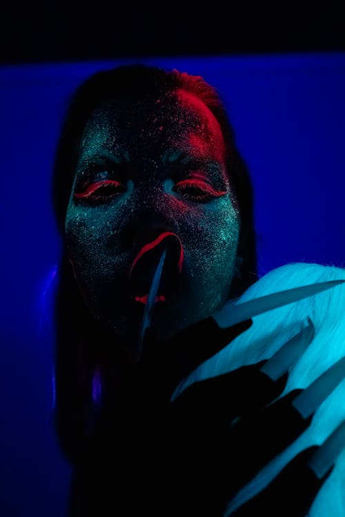 Man With Red and White Paint on Face