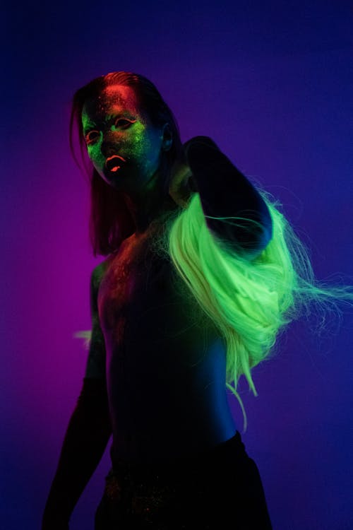 Woman in Black Tank Top With Green and Blue Hair