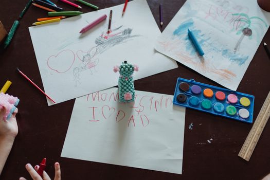 Childs Drawings Scattered on Desk