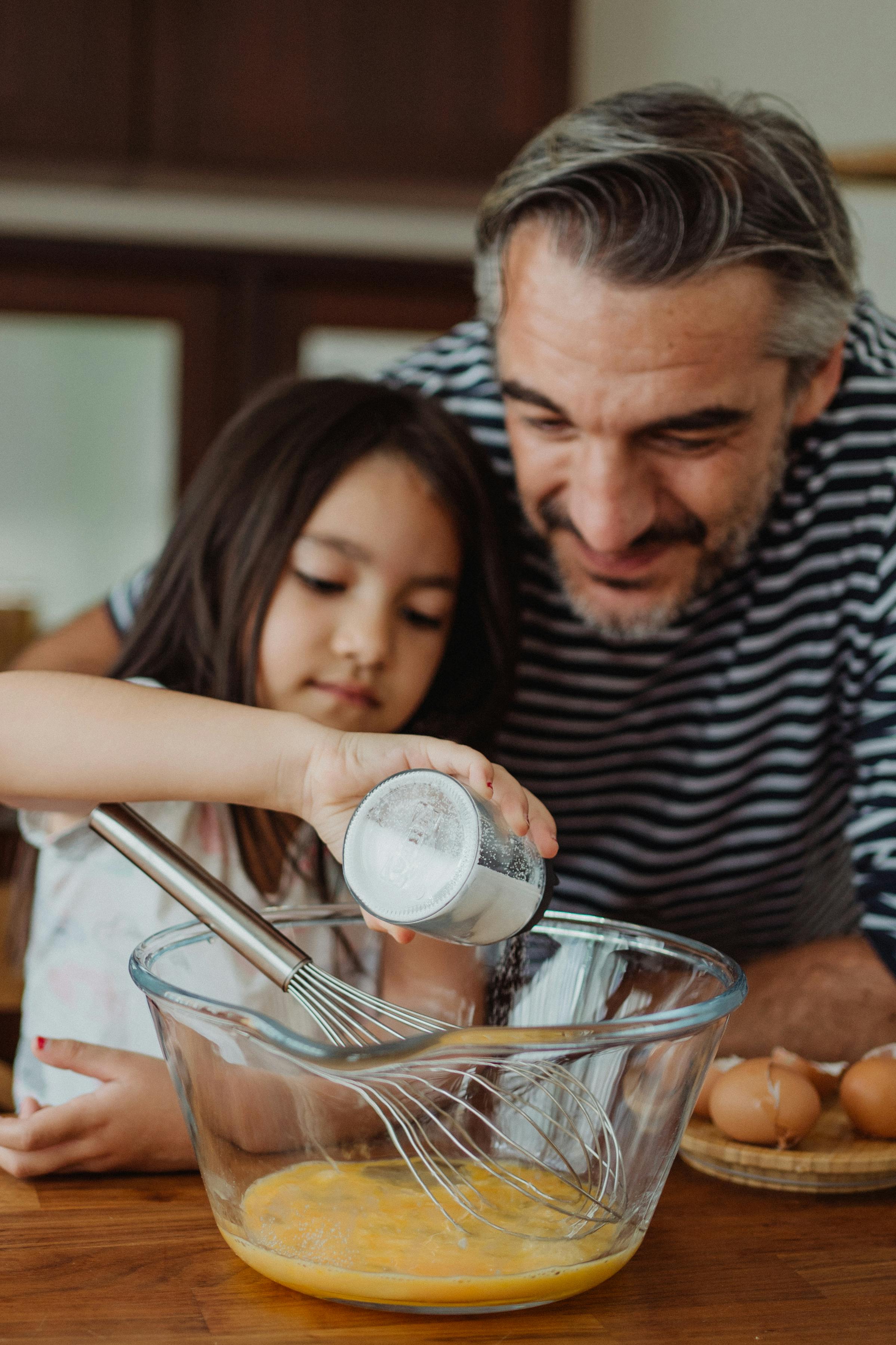 Father And Daughter Cooking Together In Kitchen · Free Stock Photo