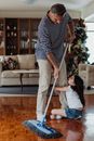 Woman in Black and White Striped Shirt and Blue Denim Jeans Holding Walking Stick