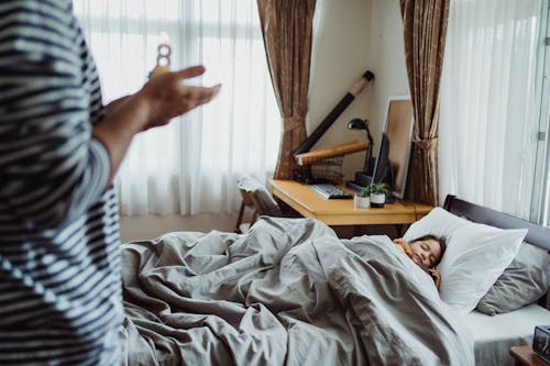 Free Father Waking up Sleeping Daughter Stock Photo