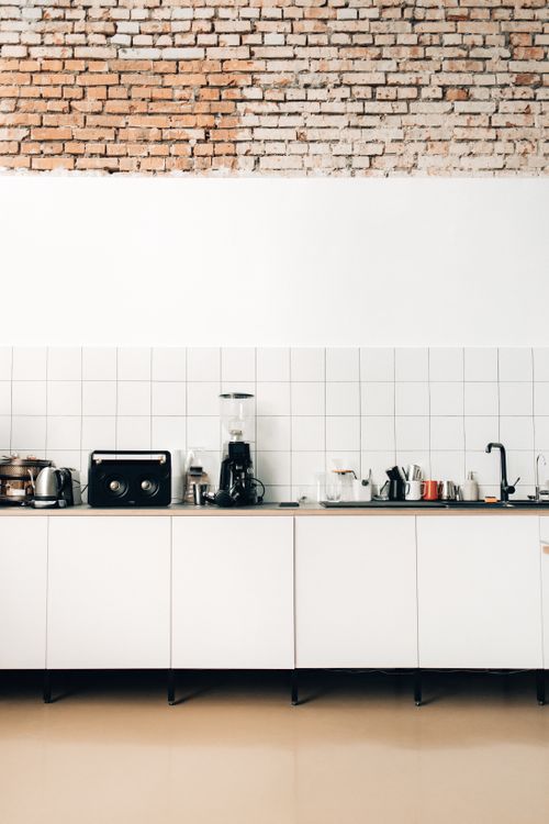 Compact rental kitchen with countertop appliances and workspace