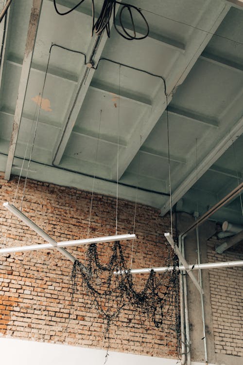 Lights Hanging from a High Ceiling in an Industrial Building 