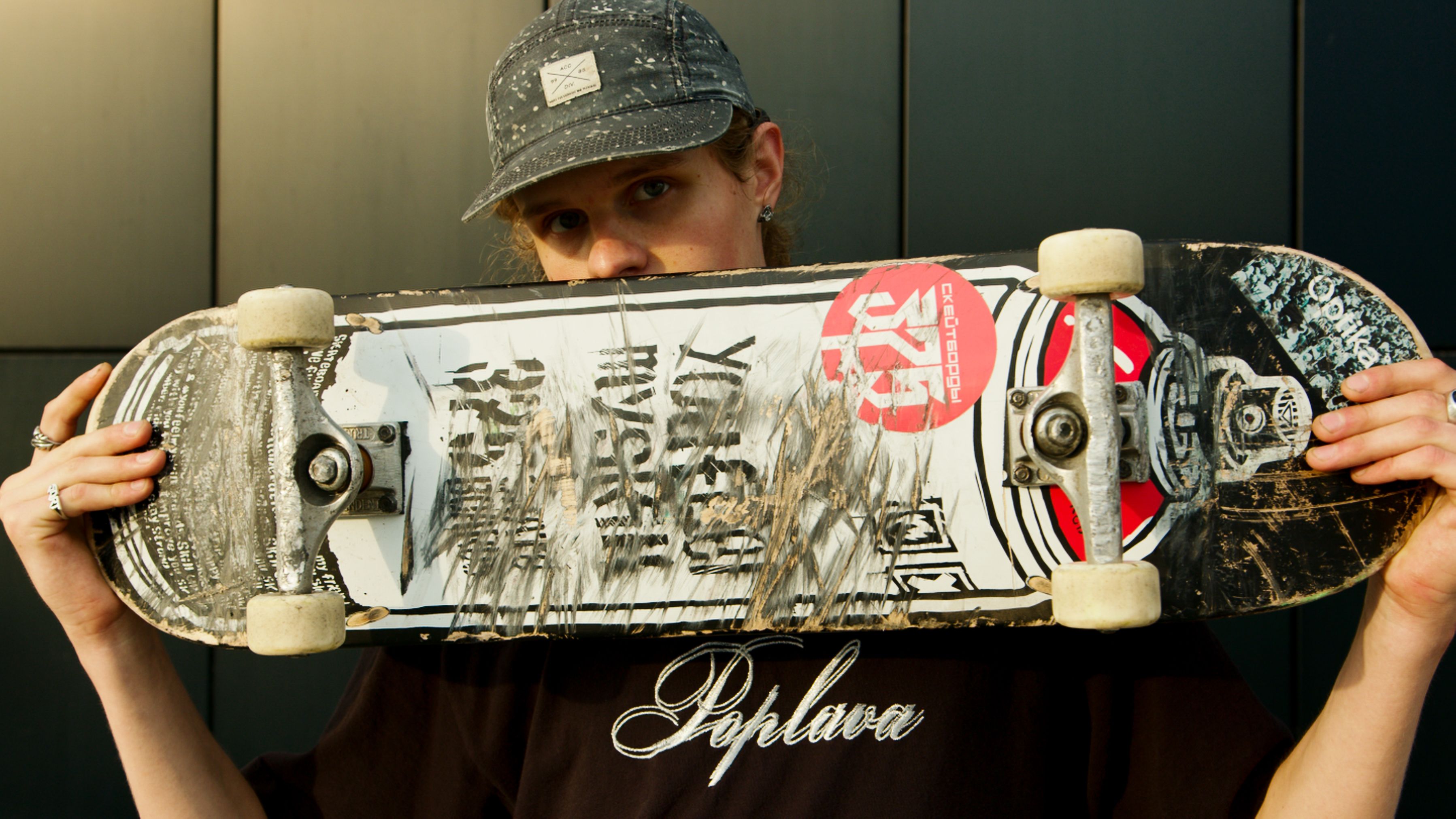 researcher comparing old skateboarding blog links with a suspicious betting advertisement on dual computer screens