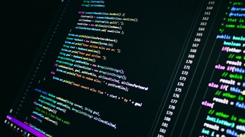 Close-up of colorful programming code on a computer screen, showcasing digital technology.