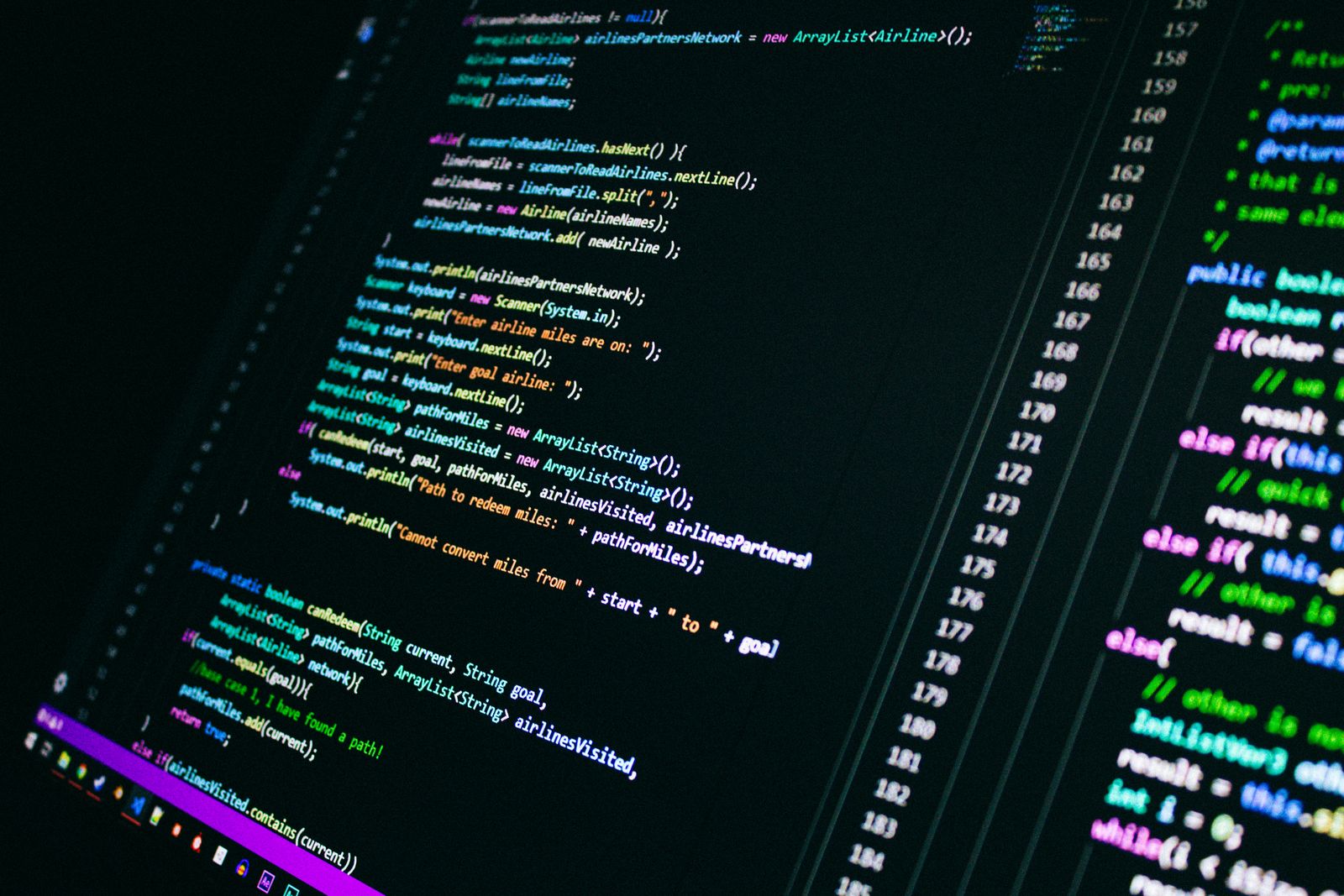 A screen showing coloured lines of Java code with their line numbers, on a dark background