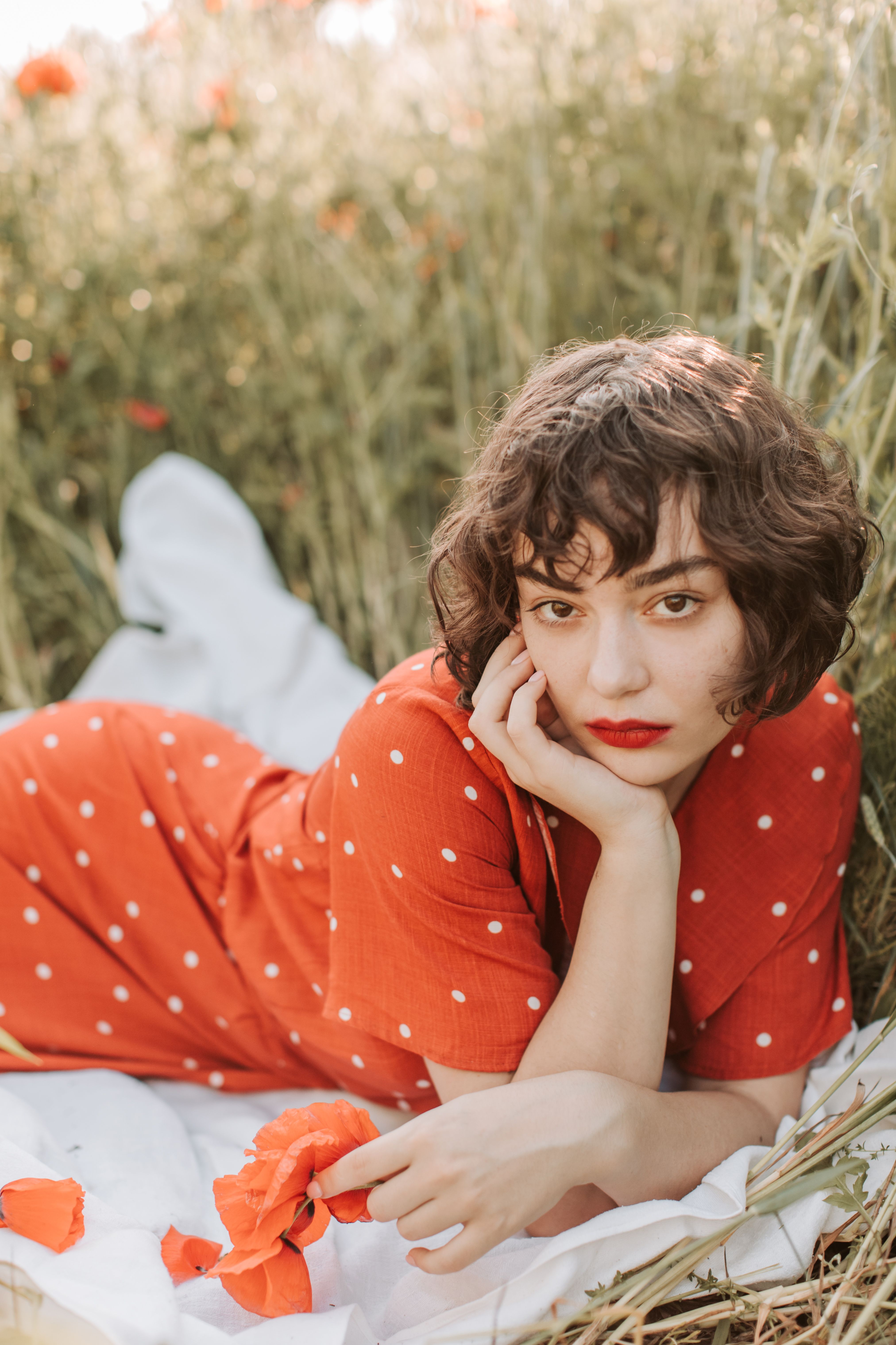 A Woman in Red Dress Posing at the Camera · Free Stock Photo