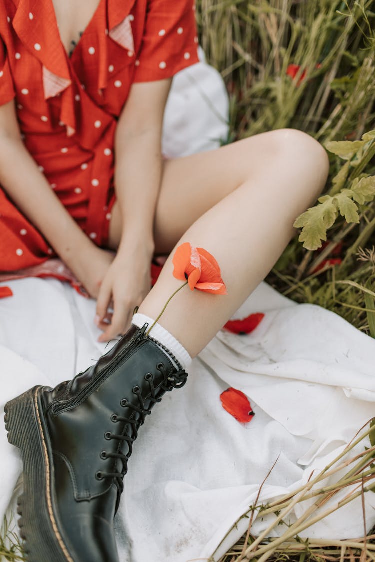 Red Flower On Black Boot