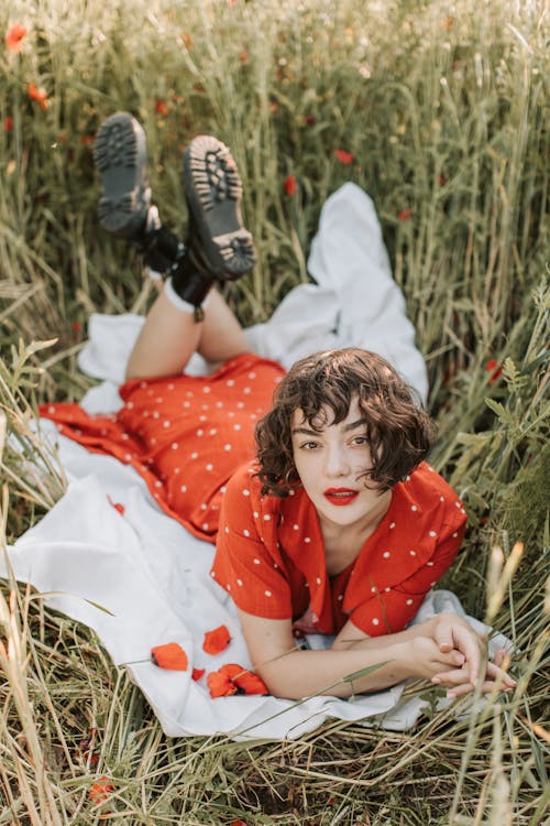 Beautiful Woman Lying on a Flower Field