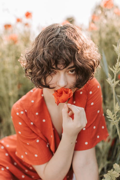 Free A Woman Kissing the Flower  Stock Photo
