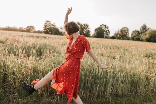 Woman Wearing Red Dress in the Field