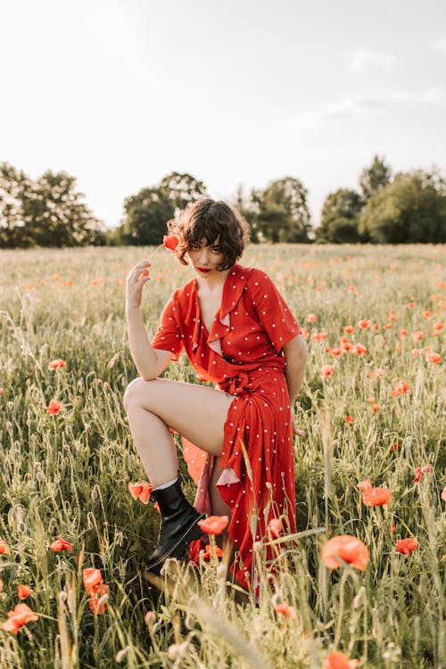 Woman in a wrap dress with ankle boots