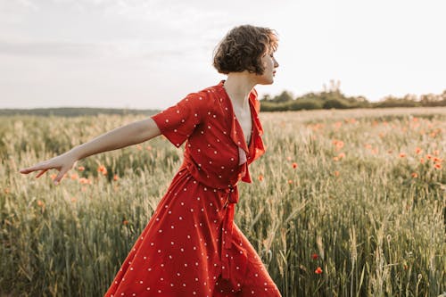 Photo of a Woman Wearing Red Polka Dots Dress