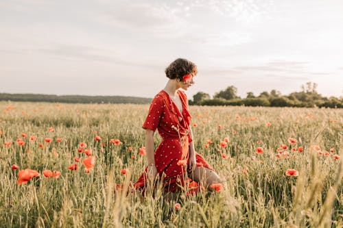 Woman in Red Dress Walking in the Field