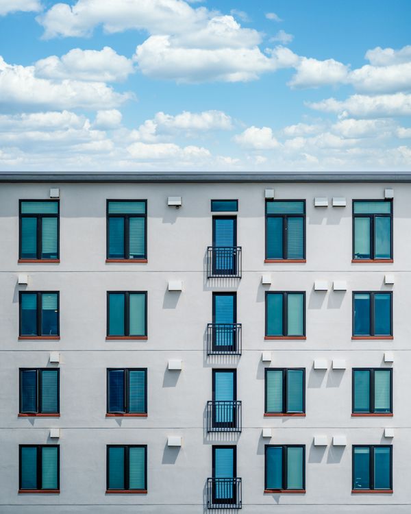 Modern building with blue windows · Free Stock Photo
