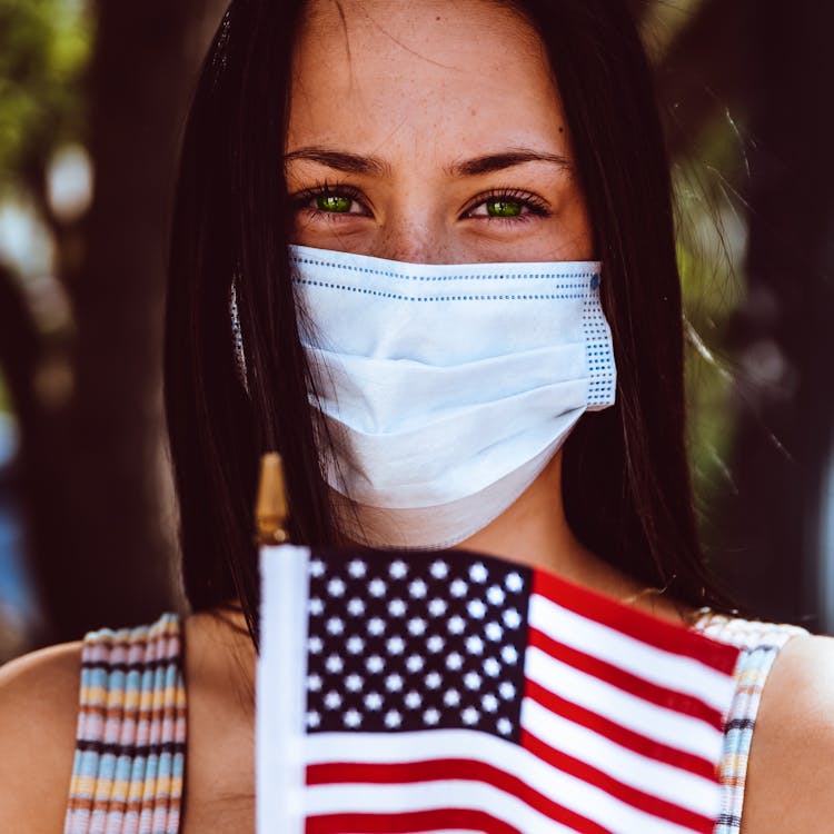 Woman In Protective Mask With American Flag