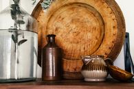 Brown Wooden Round Container Beside White Ceramic Vase
