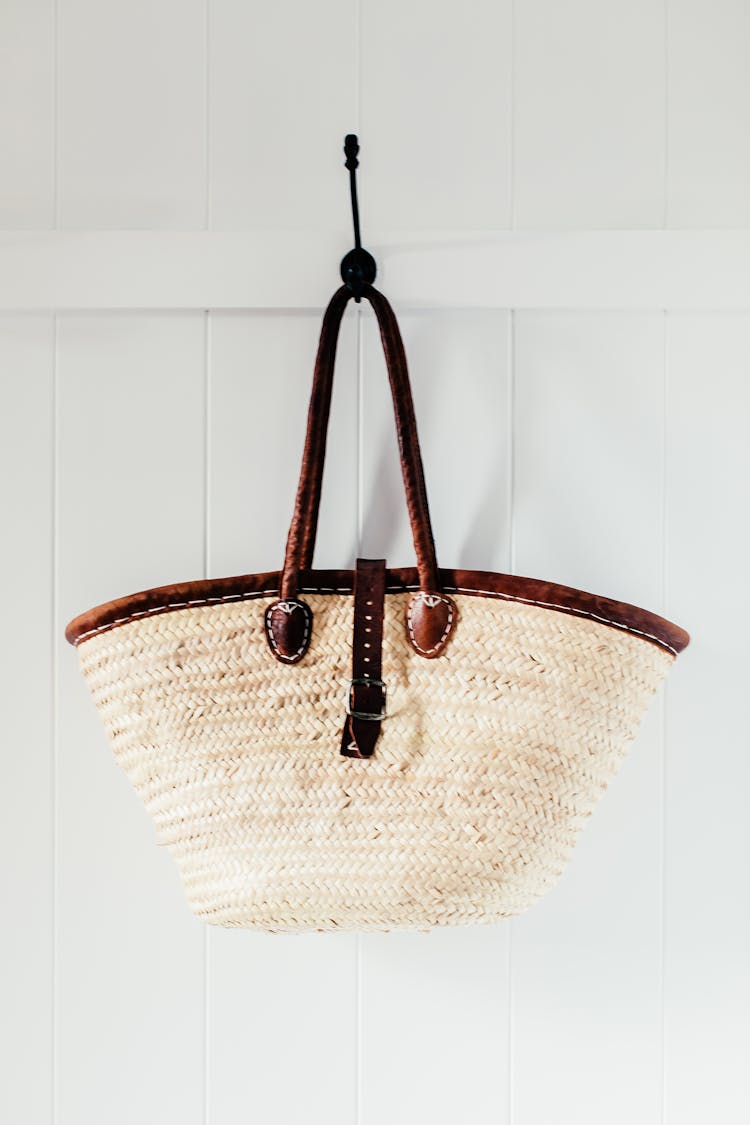 Woven Bag Hanging On White Wall 