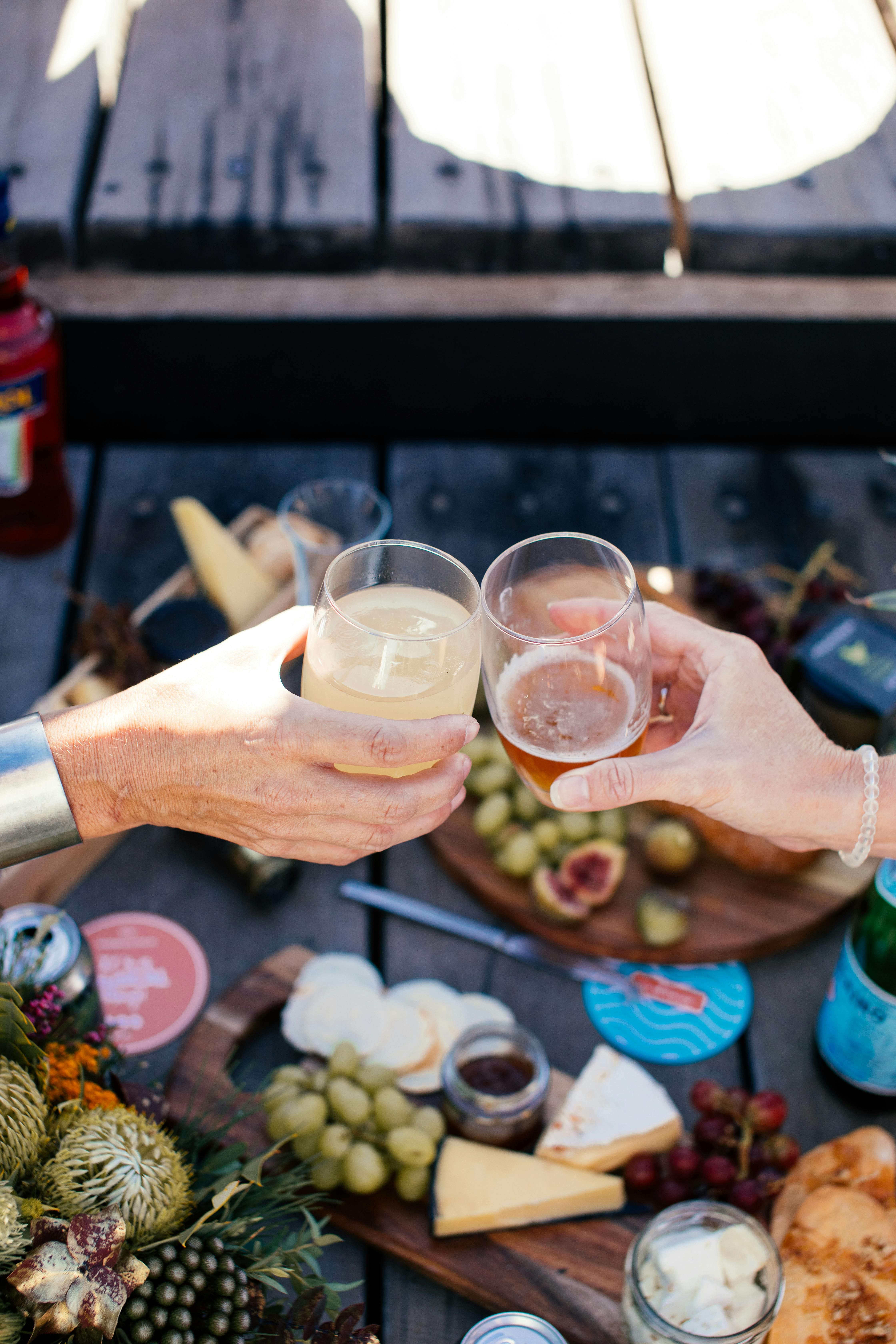 crop people clinking glasses