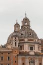 Exterior of aged famous cathedral with large dome and ornate decorative elements in overcast weather