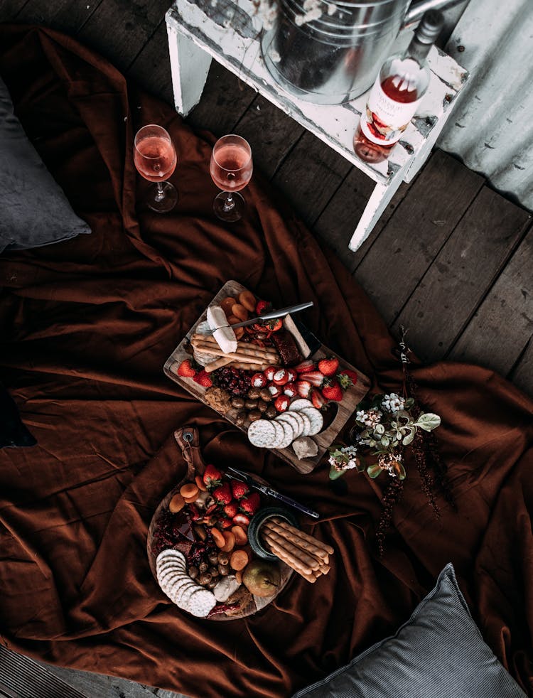 Trays With Food And Glasses Of Wine