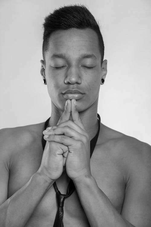 Grayscale Photo of Topless Man With Closed Eyes 