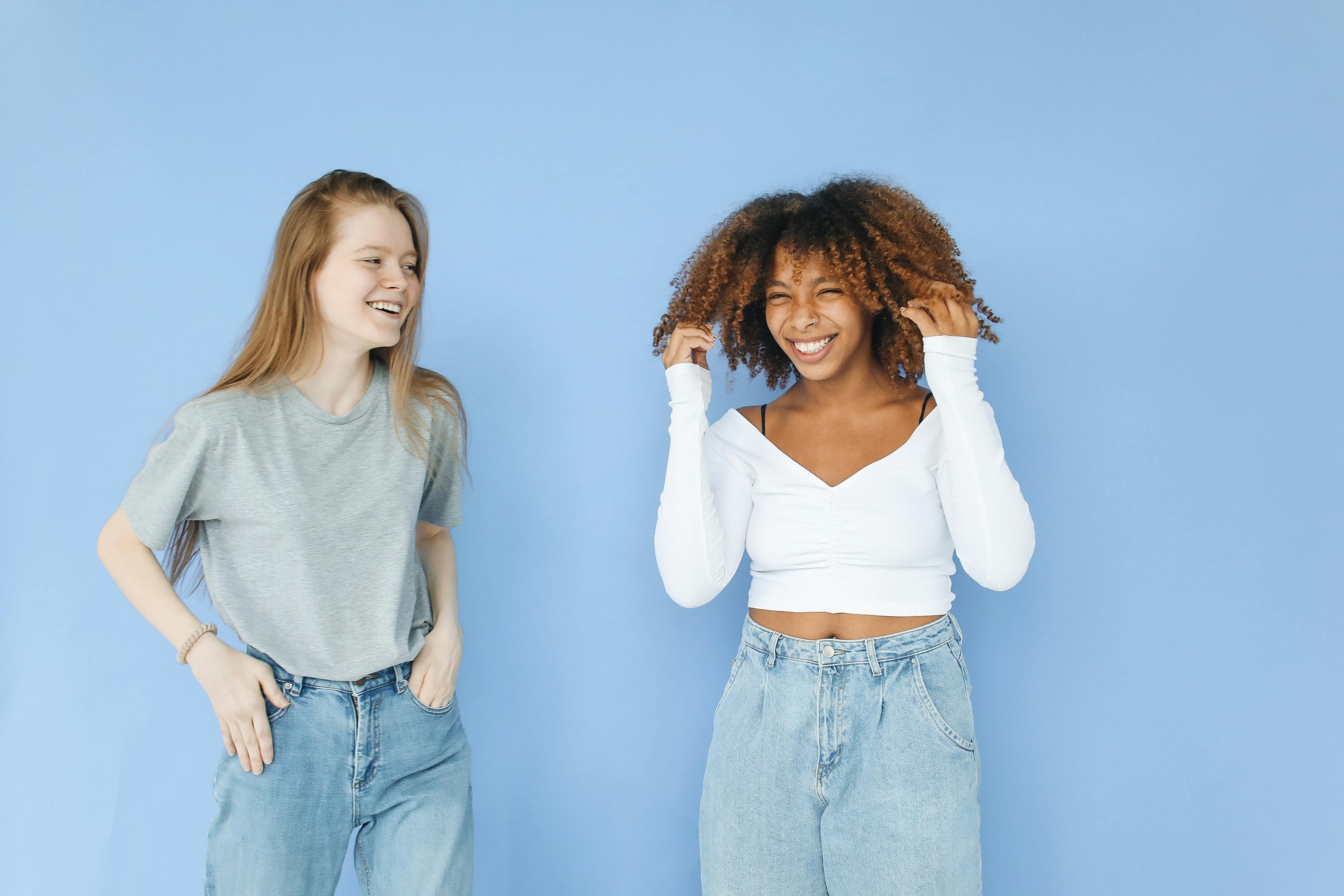 Women in Denim Jeans Laughing · Free Stock Photo