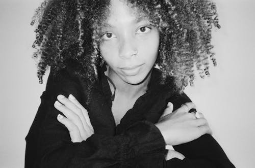 Black and White Photo of a Young Woman with Afro Hairstyle 