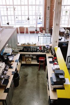 Aerial view of a modern coffee shop interior with equipment and bar counter.