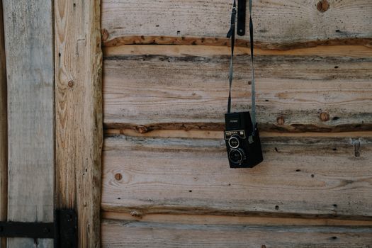 Black and Silver Steel Padlock on Brown Wooden Wall