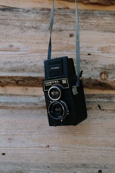 Black Nikon Dslr Camera on Brown Wooden Table