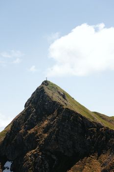 A striking mountain peak under a clear blue sky, perfect for nature lovers and travel enthusiasts.
