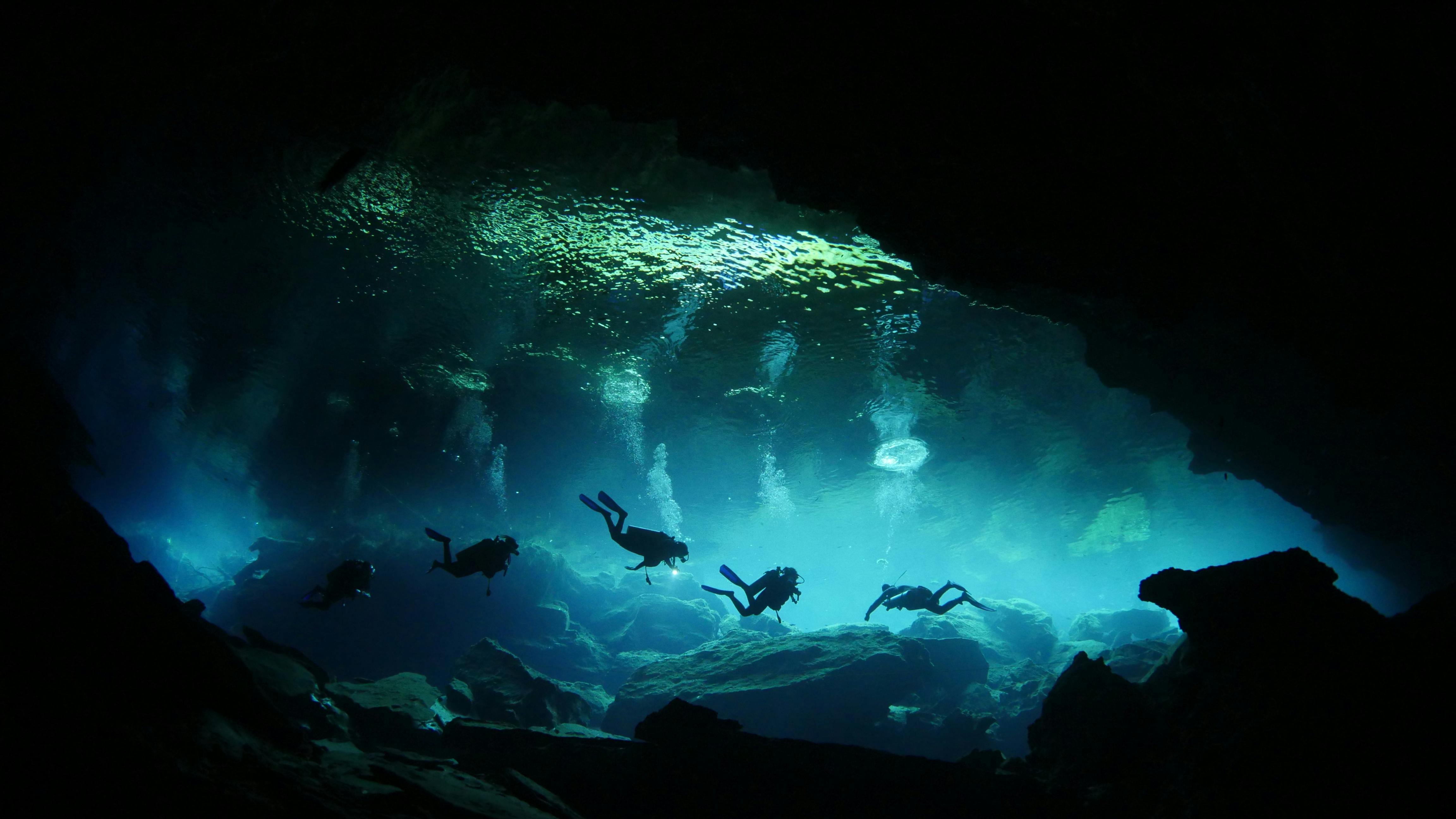 Divers in Underwater Cave