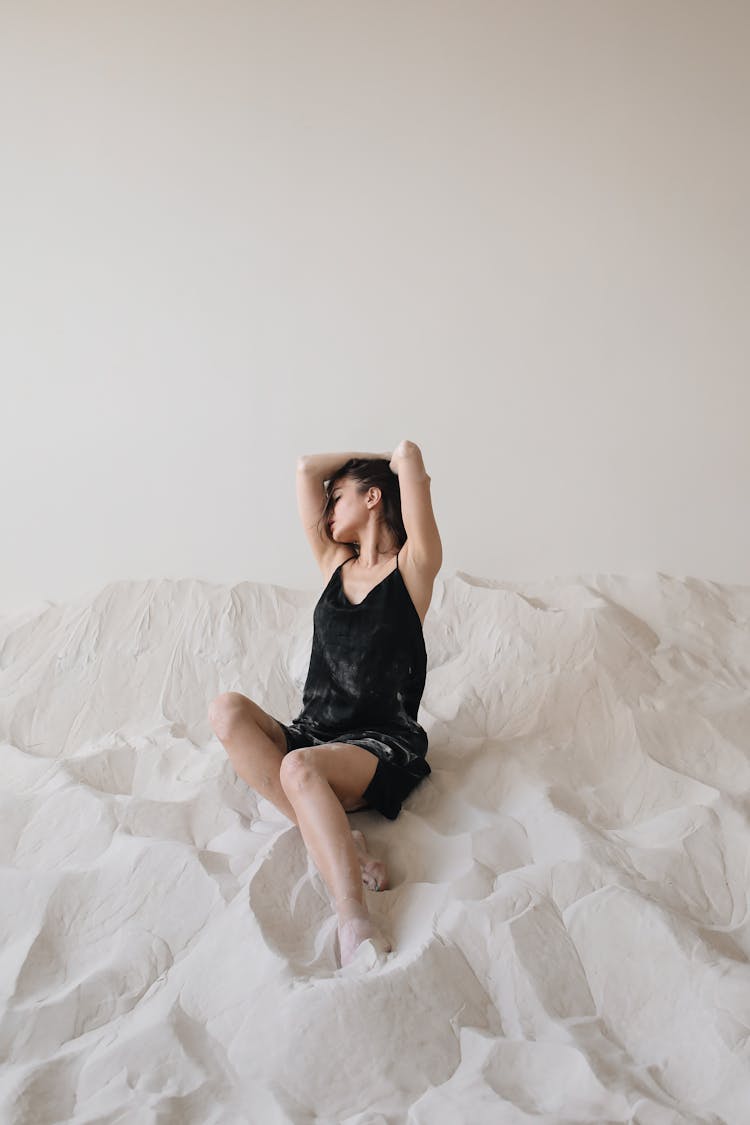 A Woman With Vitiligo Wearing A Black Dress