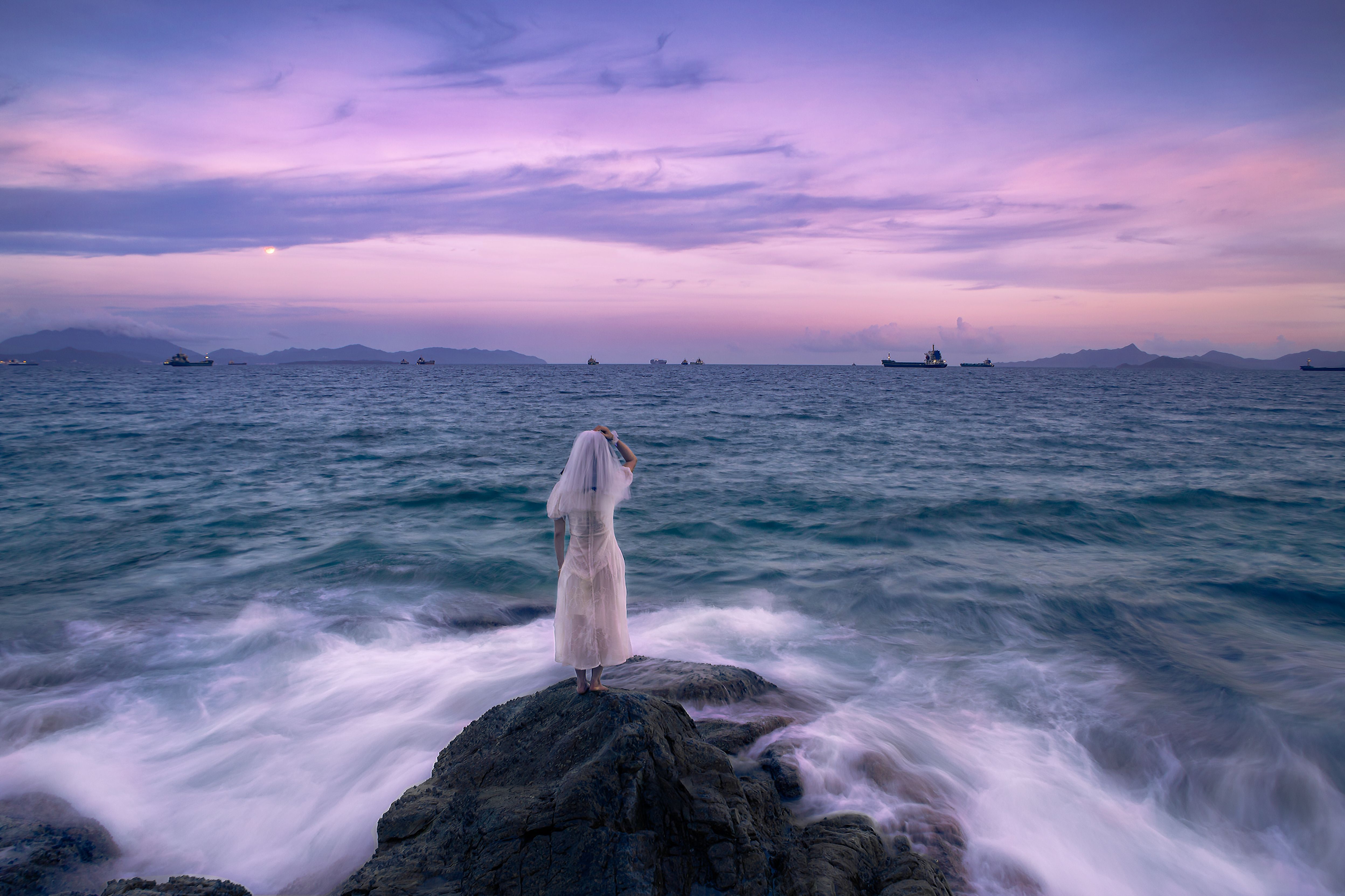 Person Wearing White Dress Standing on Rock Near the Ocean · Free Stock ...